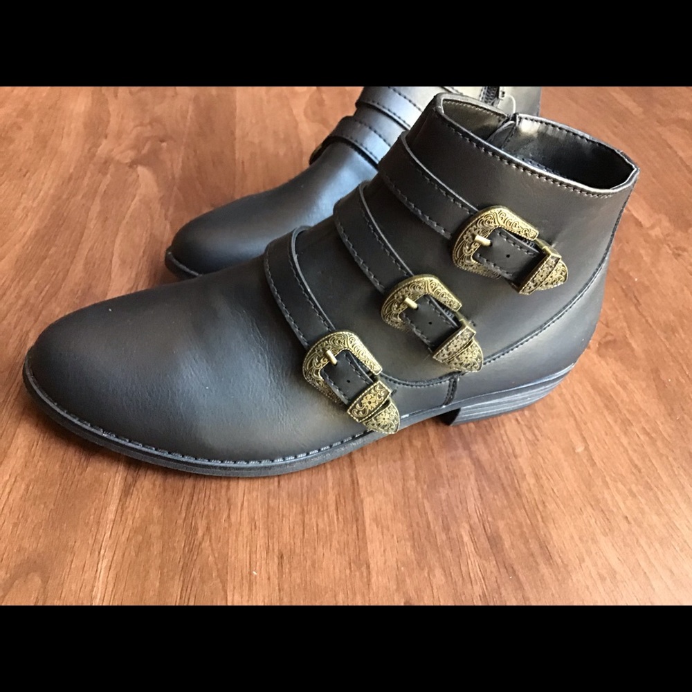 Black zip boots with buckle detail